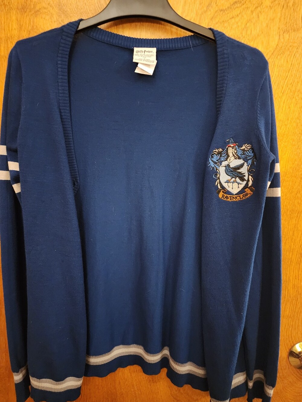 HARRY POTTER Ravenclaw Blue Open-Front Cardigan with Gray Stripes.